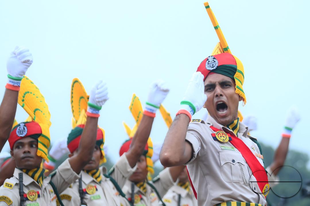 Soldiers of different platoons at the 77th Independence Day parade at the Assam Rifles ground in Agartala