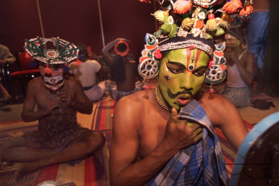 A south Indian dancer applies finishing touch before a stage show at a dance festival in Kolkata