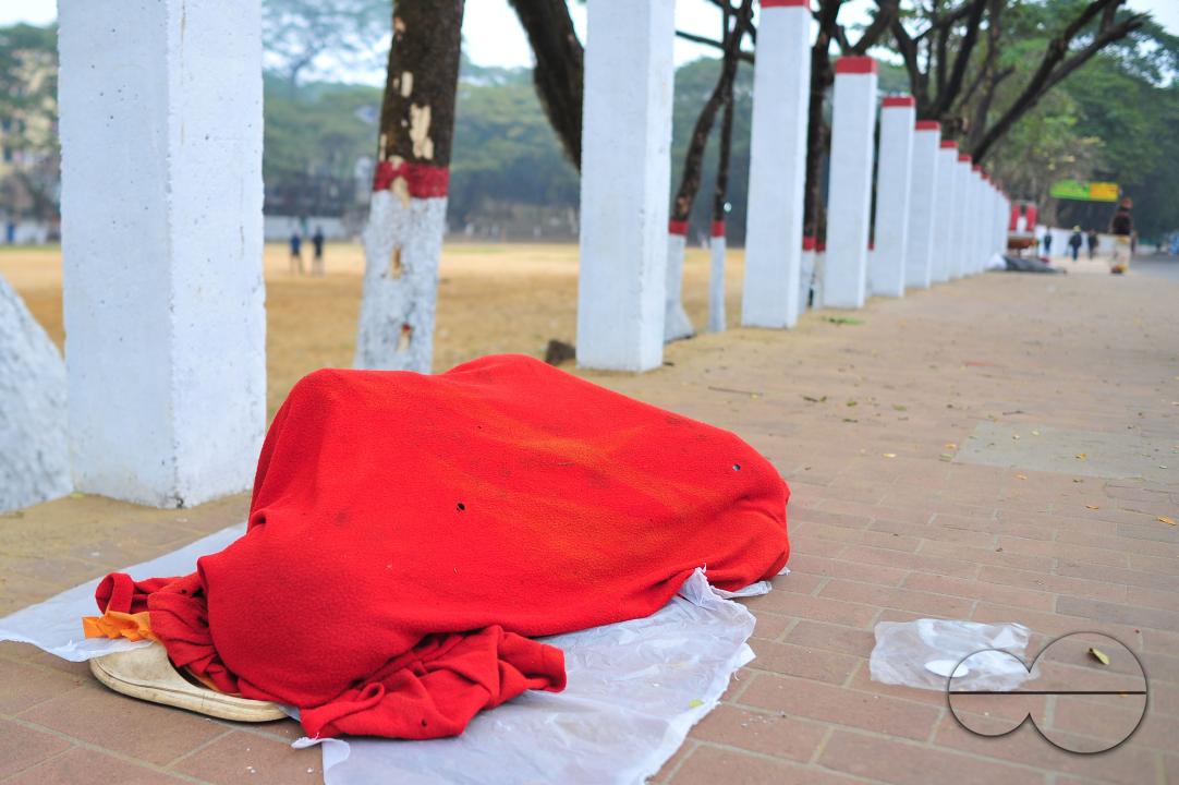 Covering their bodies from head to toe with whatever they can manage, homeless people sleep out in the open in the shivering cold near the Government Alia Madrasa in Sylhet city's Chowhatta area