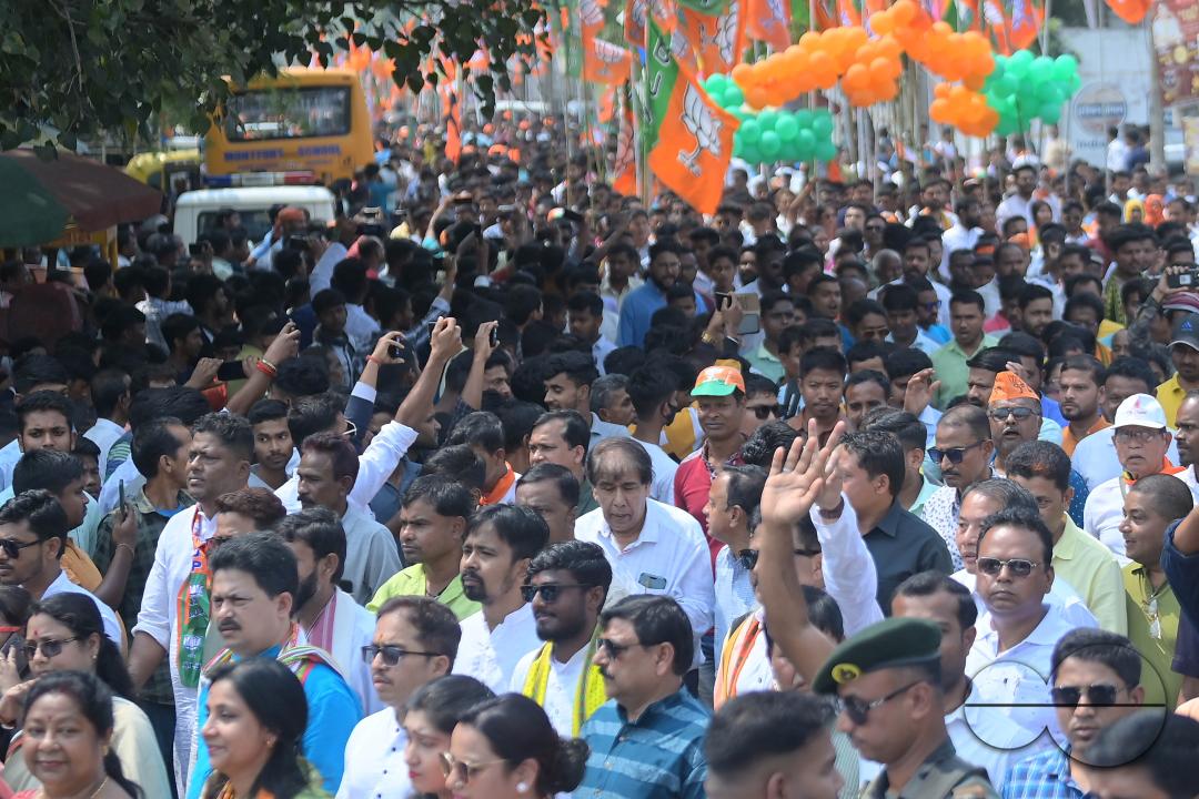 BJP supporters seen in a rally with Tripura Chief Minister Manik Saha, former CM and BJP candidate Biplab Kumar Deb, and Kriti Singh along with other leaders during an election campaign rally in support of Lok Sabha candidates at Agartala