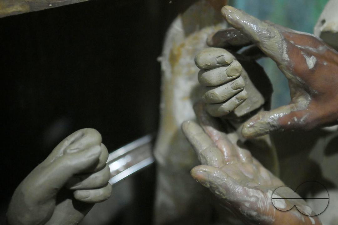 An Idol maker making idols of Lord Ganesh in a studio for the upcoming Ganesh Chaturthi festival at Agartala