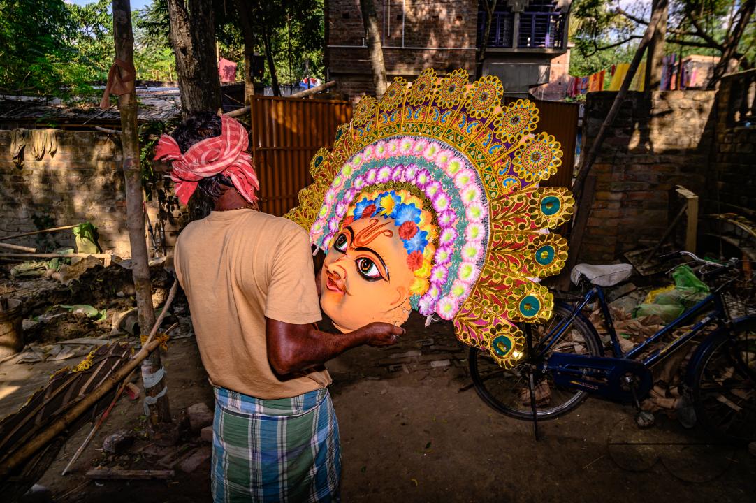 A village idol artist makes large color masks modeled after Purulia Chhau dance masks (Purulia Chhau dance is listed on UNESCO's World Heritage list of dances) of goddesses, animals, and rakshasas (humanoid demons or unrighteous spirits) like Hindu mytho