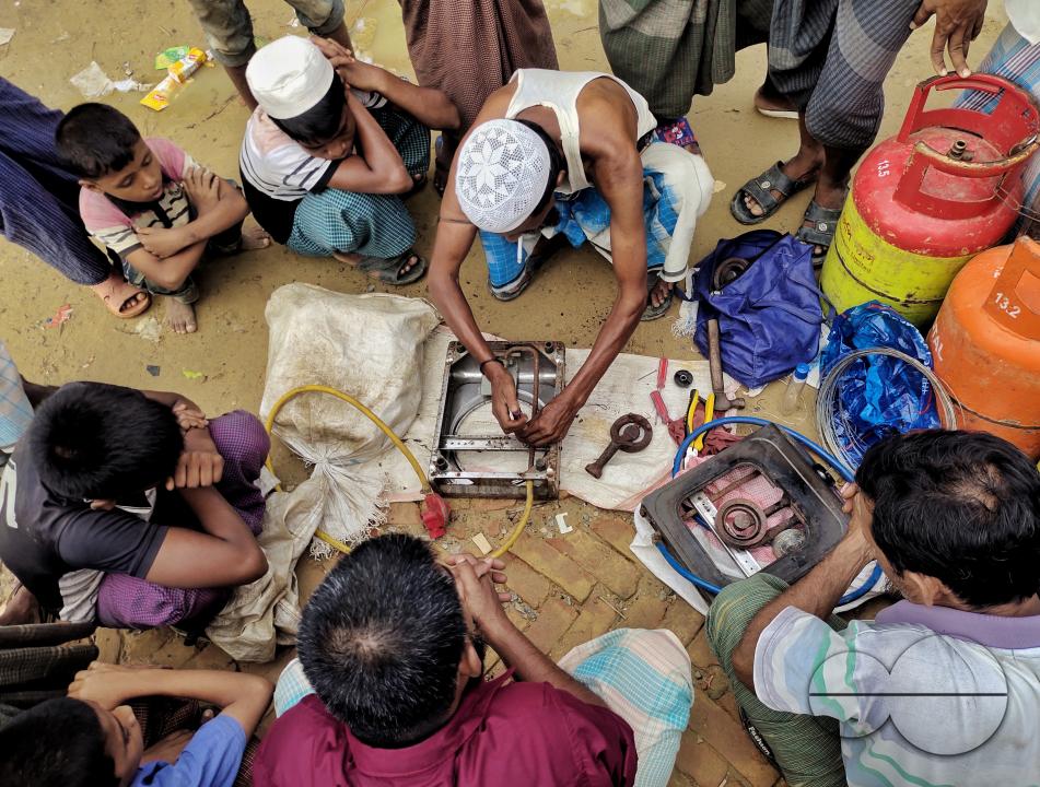 A man repairing cooking stoves