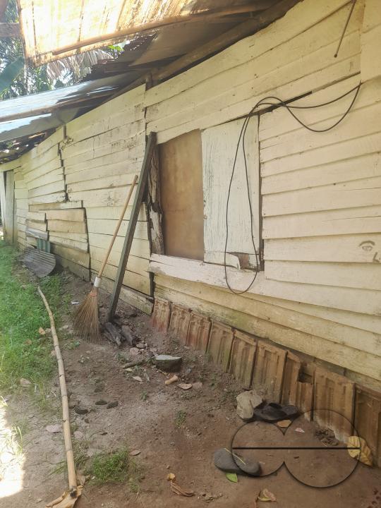 A poor family lives in a plank house on the verge of collapsing. Colombo, Sri Lanka.