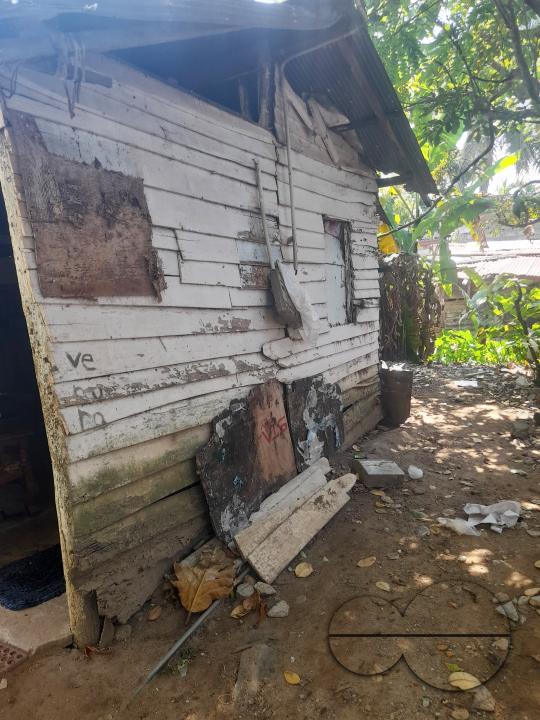 A poor family lives in a plank house on the verge of collapsing. Colombo, Sri Lanka.