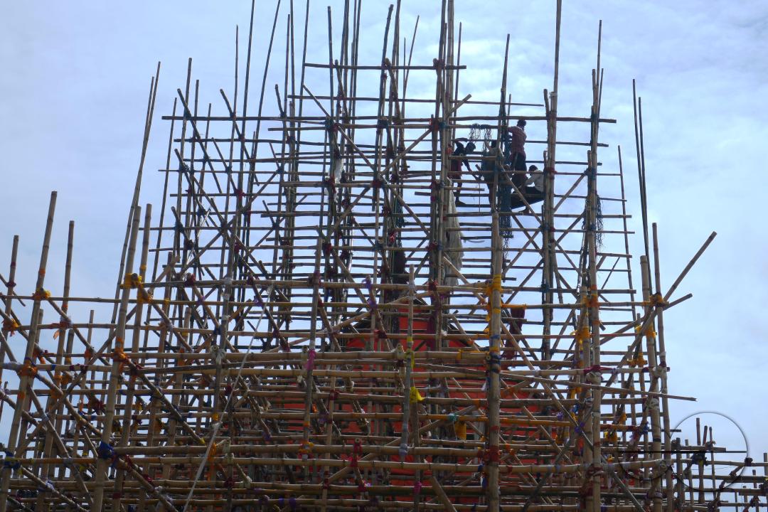 Workers are making a temporary bamboo structure, locally called "Pandal", for the upcoming Durga Puja in Agartala