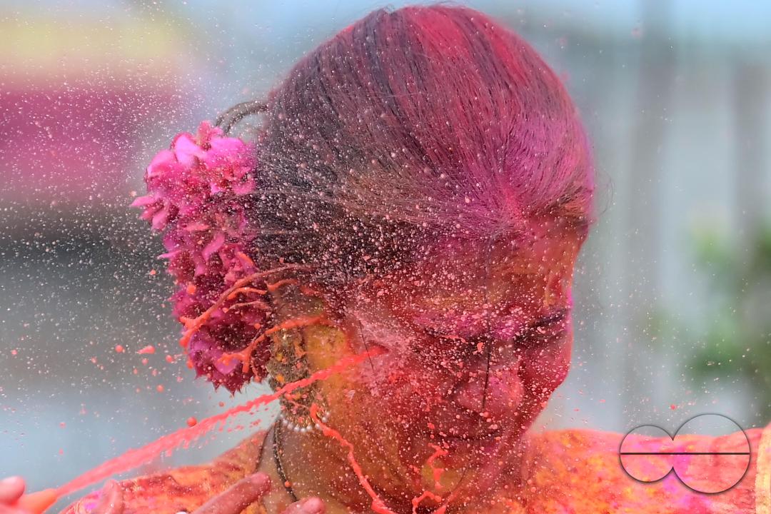 Indian girls adorned with 'Gulal' or coloured powder during the Hindu spring festival 'Holi', the festival of colour in Agartala