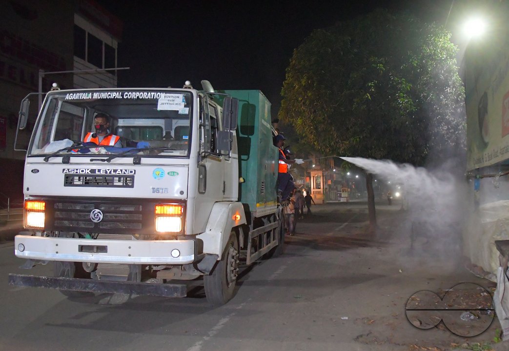 Workers Spray Disinfectant to Contain Coronavirus