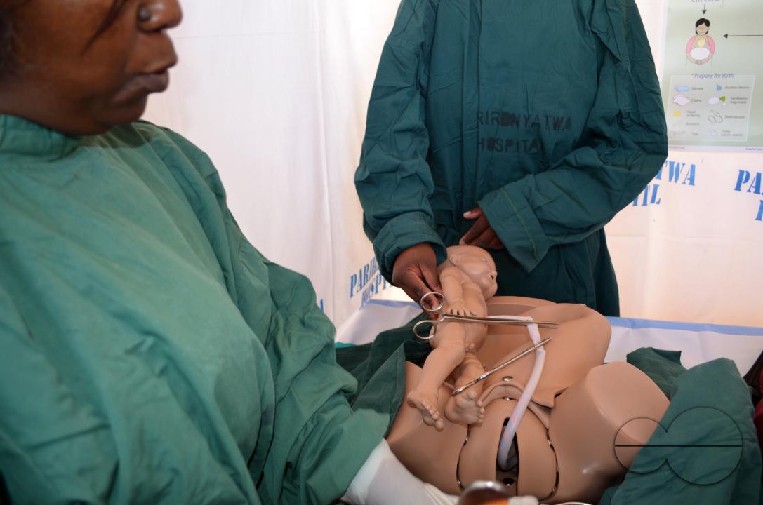 Student Midwives Benedict Munhuwei and Evelyn Kauirai demonstrate how they help women deliver babies at the Parirenyatwa Hospital Open day, in Harare, Zimbabwe.