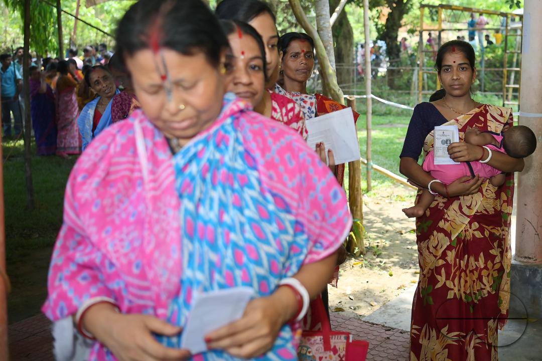 Voters queue up at a Sonamura polling station in Agartala for the Lok Sabha elections