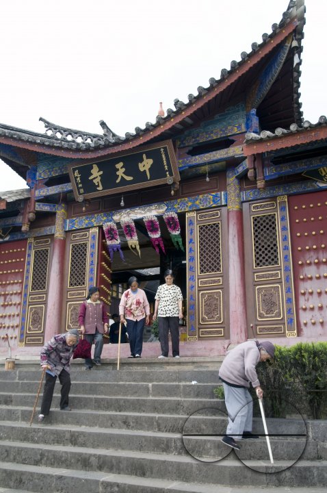 CHINA Elderly people leaving a temple in a village in Yunnan province.