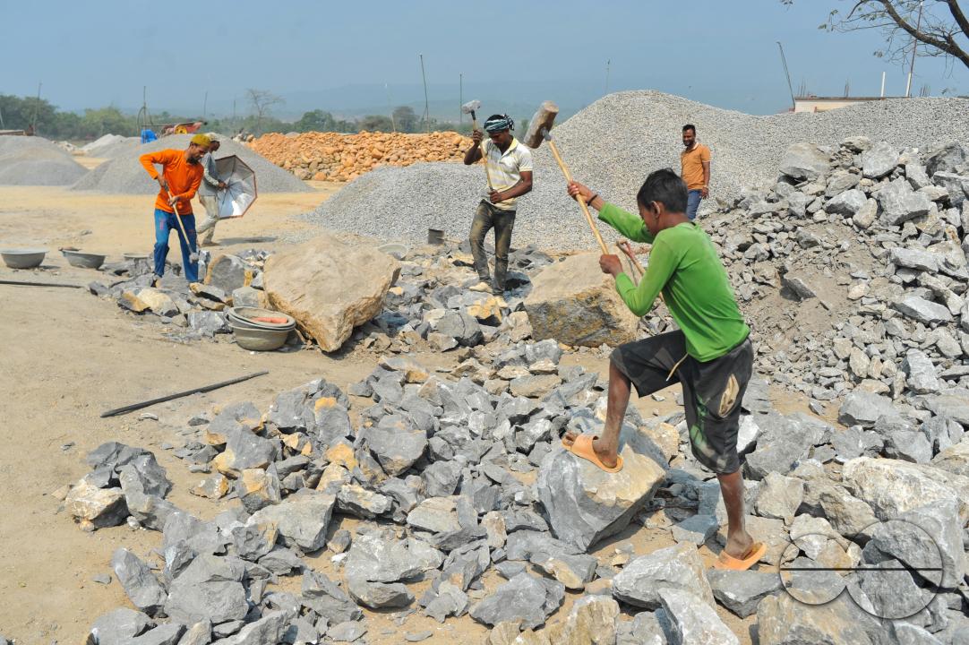 Male and female workers are breaking LC stones with a crusher machine in Bholaganj area, known as the 'Stone State' of Sylhet Companyganj Upazila