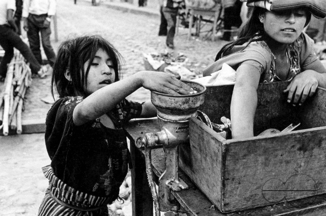 GUATEMALA INDIAN WOMAN AND DAUGHTER GRINDING COFFEE CHICHICASTENANGO, 1992
