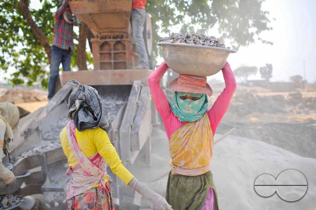 Male and female workers are breaking LC stones with a crusher machine in Bholaganj area, known as the 'Stone State' of Sylhet Companyganj Upazila
