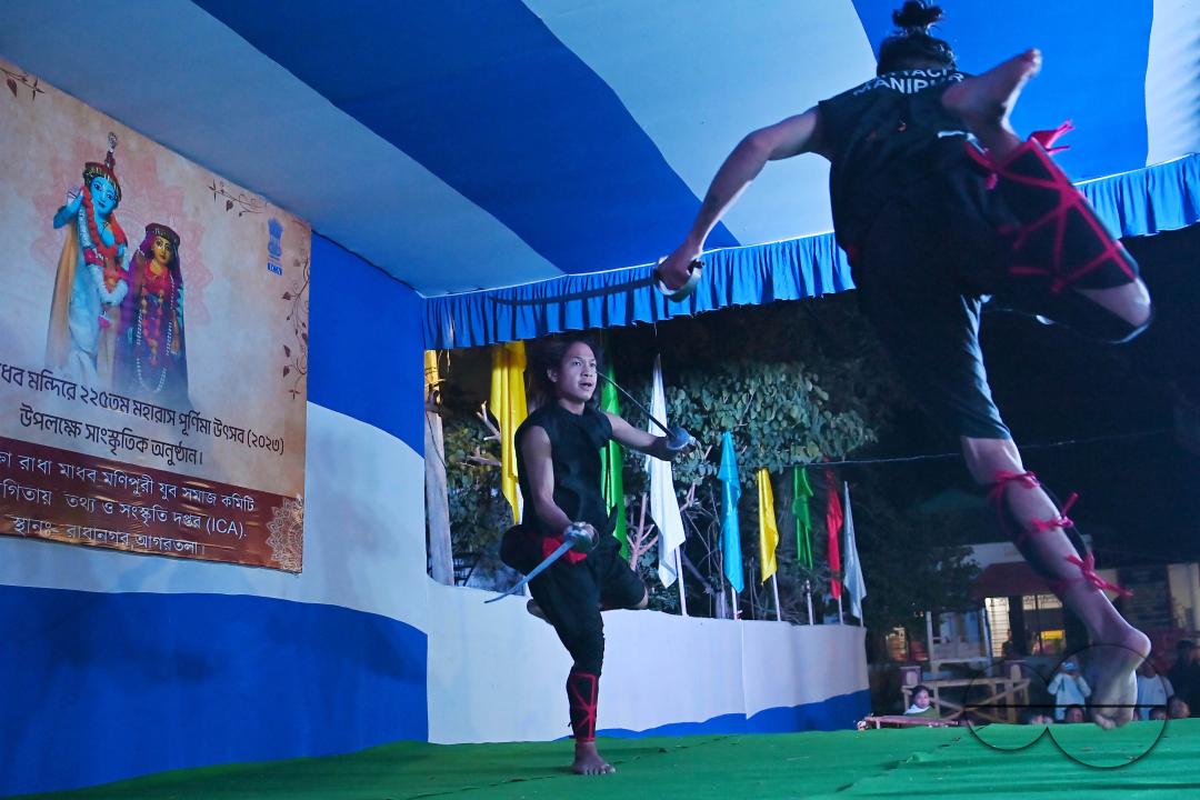 Manipuri martial arts students performing at the opening program of the 225th Raas Festival in Radha madhab Mandir at Agartala