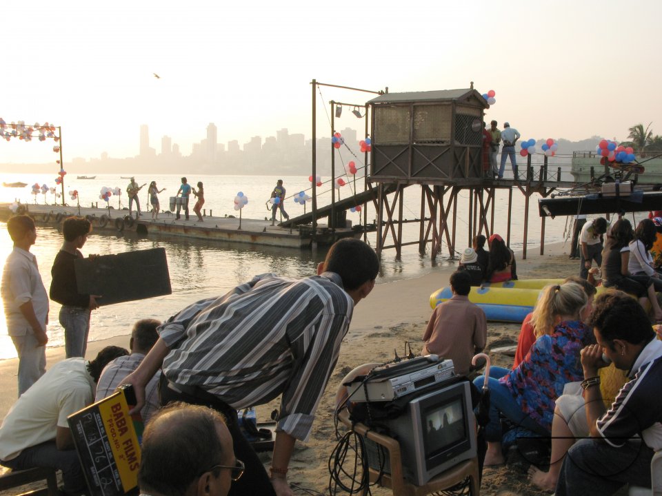 INDIA.Filming a music and dance routine in a set at Chowpatty beach in Mumbai.