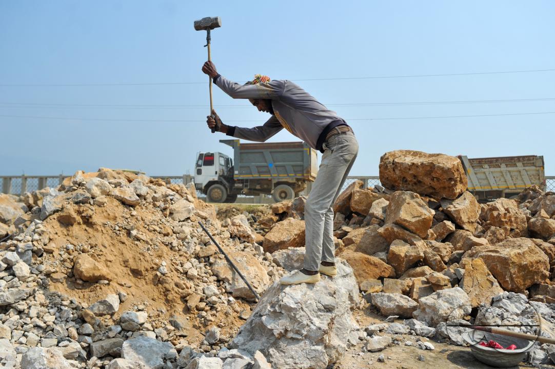 Male and female workers are breaking LC stones with a crusher machine in Bholaganj area, known as the 'Stone State' of Sylhet Companyganj Upazila