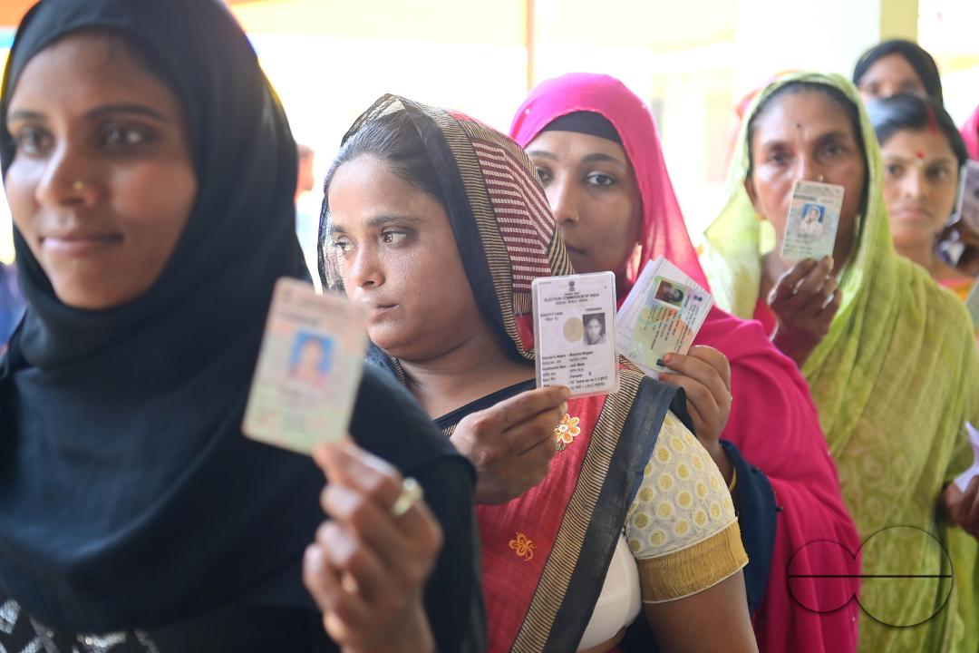 Muslim voters patiently await their turn to cast their votes at a Boxanagar polling station in Agartala in the first phase of Lok Sabha elections