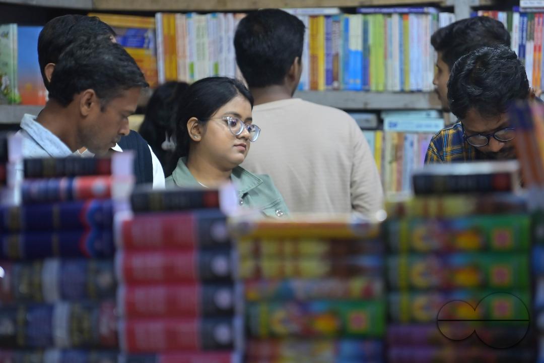 People looking at books in a book stall at the 42nd Agartala Book fair International Fair Ground, Hapania at Agartala