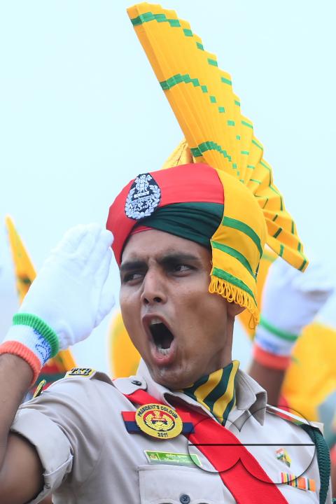 Soldiers of different platoons at the 77th Independence Day parade at the Assam Rifles ground in Agartala