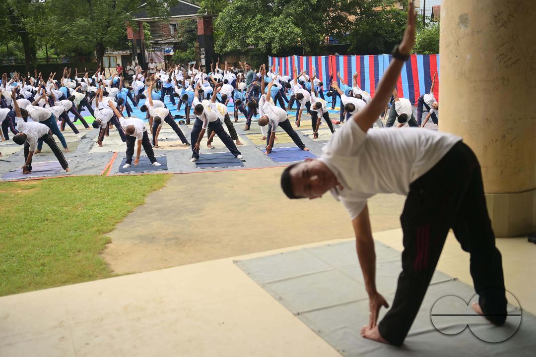 NCC cadets and officials perform yoga during 10th International Day of Yoga Day at BBM College Ground in Agartala