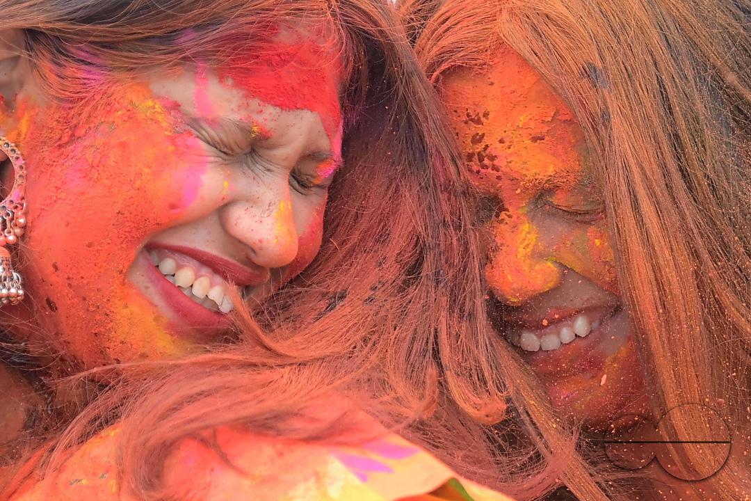Indian girls adorned with 'Gulal' or coloured powder during the Hindu spring festival 'Holi', the festival of colour in Agartala