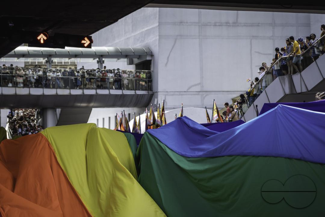 Participants of Bangkok Pride Parade 2023 are carrying a giant rainbow flag at Pathumwan Intersection, in Bangkok, Thailand.