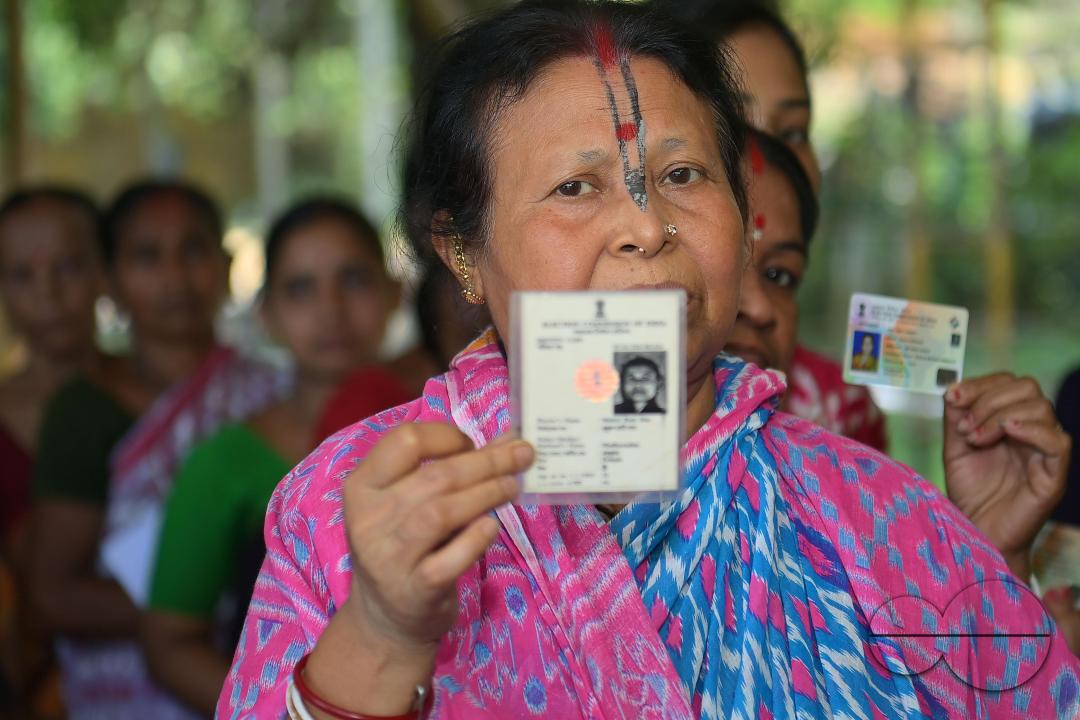 Voters queue up at a Sonamura polling station in Agartala for the Lok Sabha elections