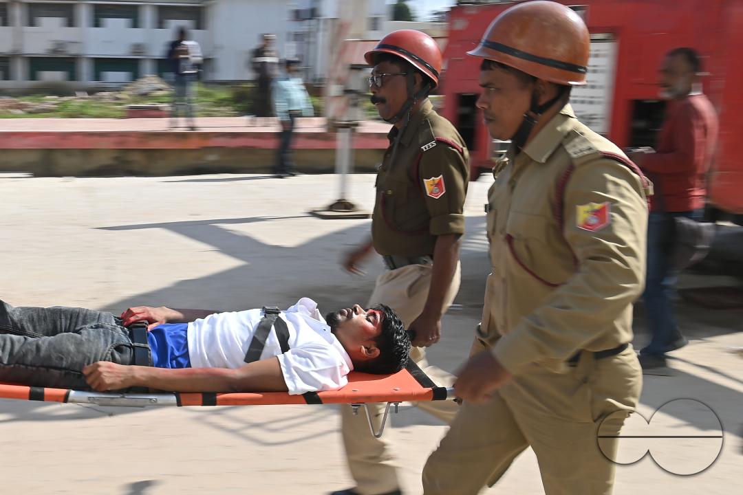 Fire brigade personnel are trying to control a fire on the top of the building of the dental college during a state level mock exercise on earthquake day at Agartala