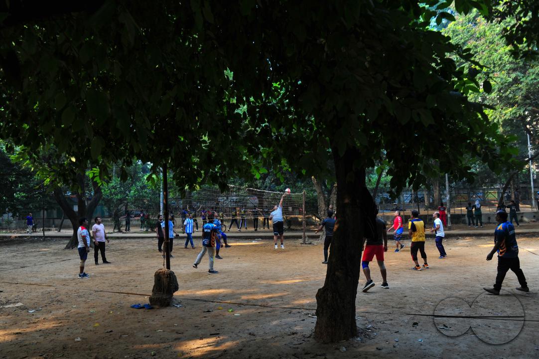 People playing volleyball in the Dhanmondi Lake