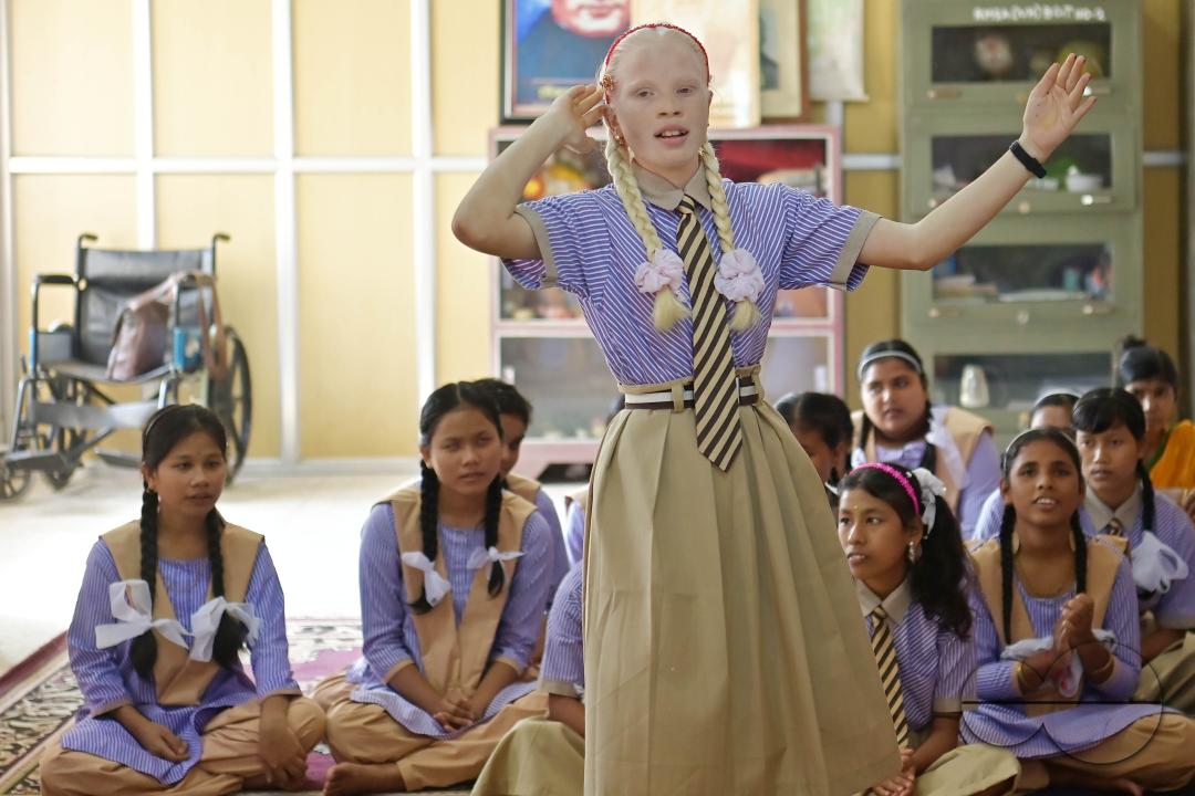 A student at the Institute for Visually Handicapped is performing a dance during the 'Children's Day' celebration at the institute's campus in Narsingarh, in Agartala