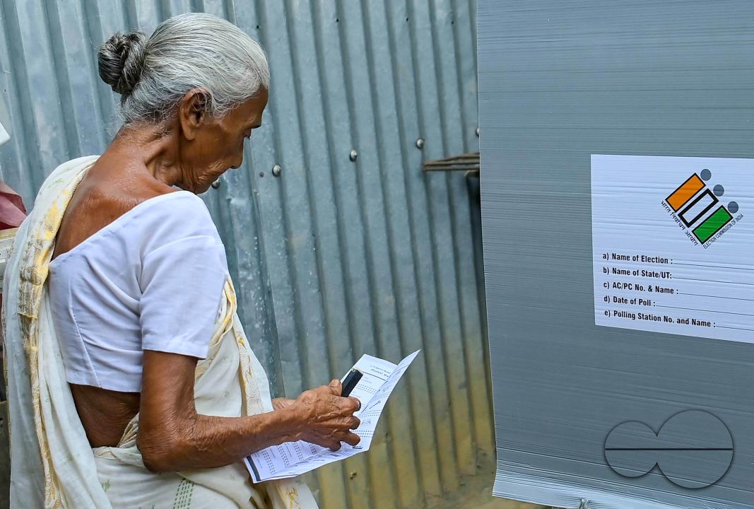 A 101-year-old woman cast her vote through a postal ballot with the assistance of a family member at her home in Agartala, under the supervision of election officials and security personnel