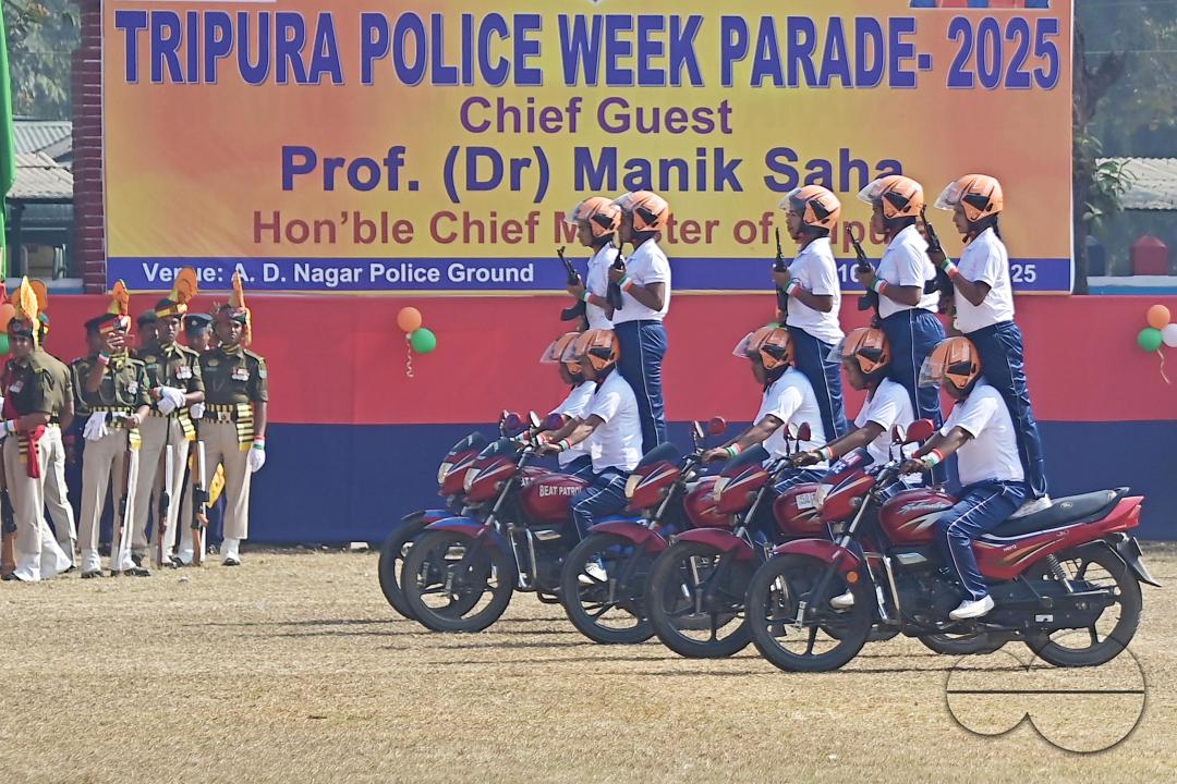 The female police motorcycle display team performs during the celebration of 150 years of Tripura Police Week at the stadium of A.D