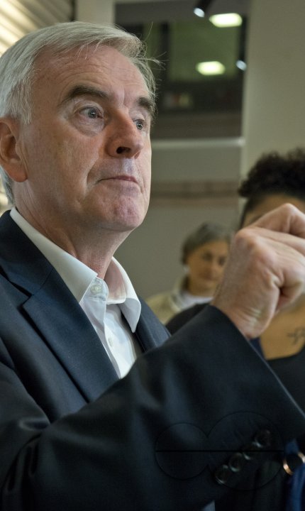London,UK.20th September 2016. Momentum supporters and phone-bank volunteers listen to John McDonnell at Unite Union HQ in London.