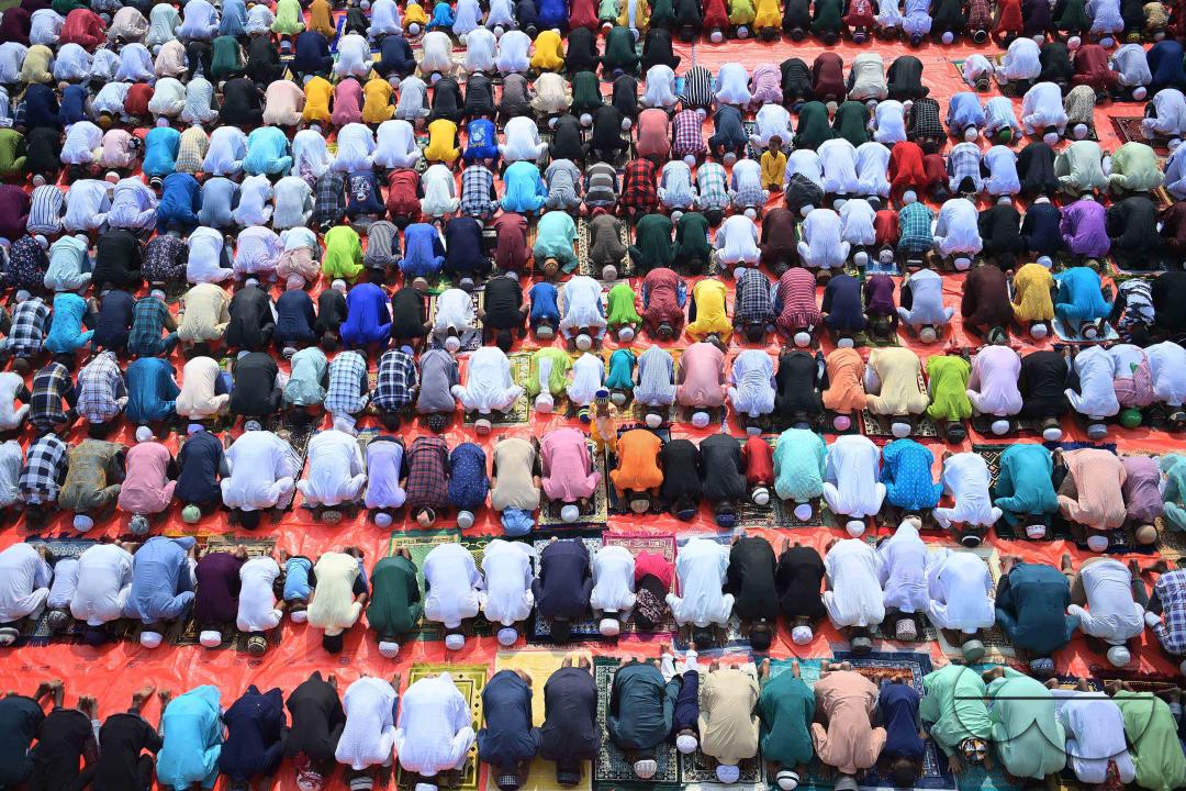 Devotees celebrate Eid-ul-Fitr with prayers ("Namaz") at a mosque in Agartala