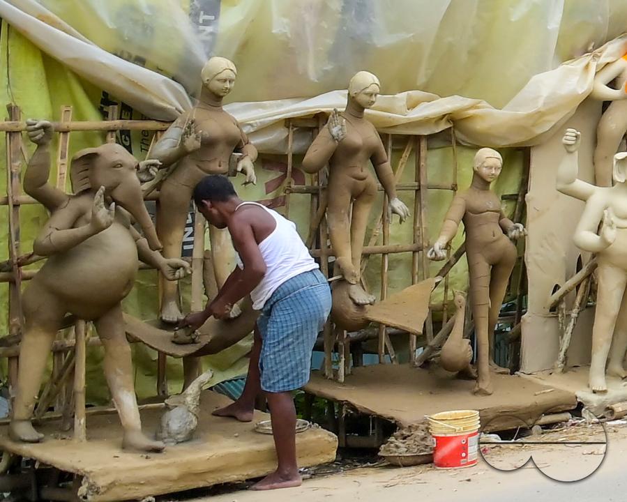 Idol makers adding finishing touches to an idol of the Mother Goddess Durga in a studio, ahead of the Durga Puja festival in Agartala, Tripura, India.