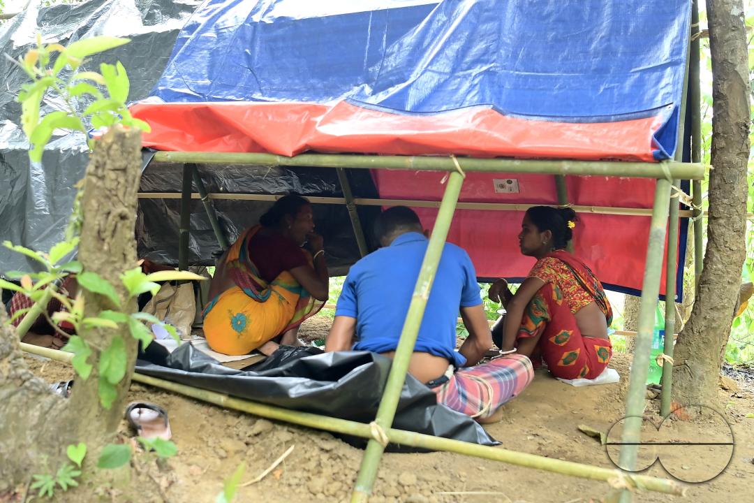 People in makeshift tents at Panisagar's reserve forest area