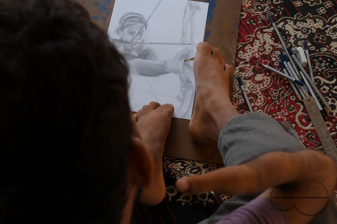 A 23-year-old differently abled artist Pralay Dey, is pursuing his bachelorâs degree in psychology from Tripura Central University