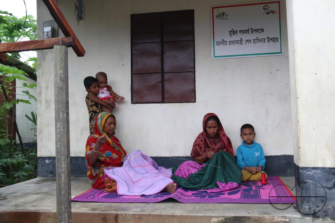 Rural Bangladeshi women sewing and embroidering bed sheets, pillow cases, rugs, table cloths and other household items which is their livelihood
