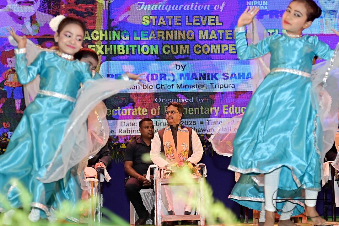 School children perform a dance in front of Tripura Chief Minister, Prof