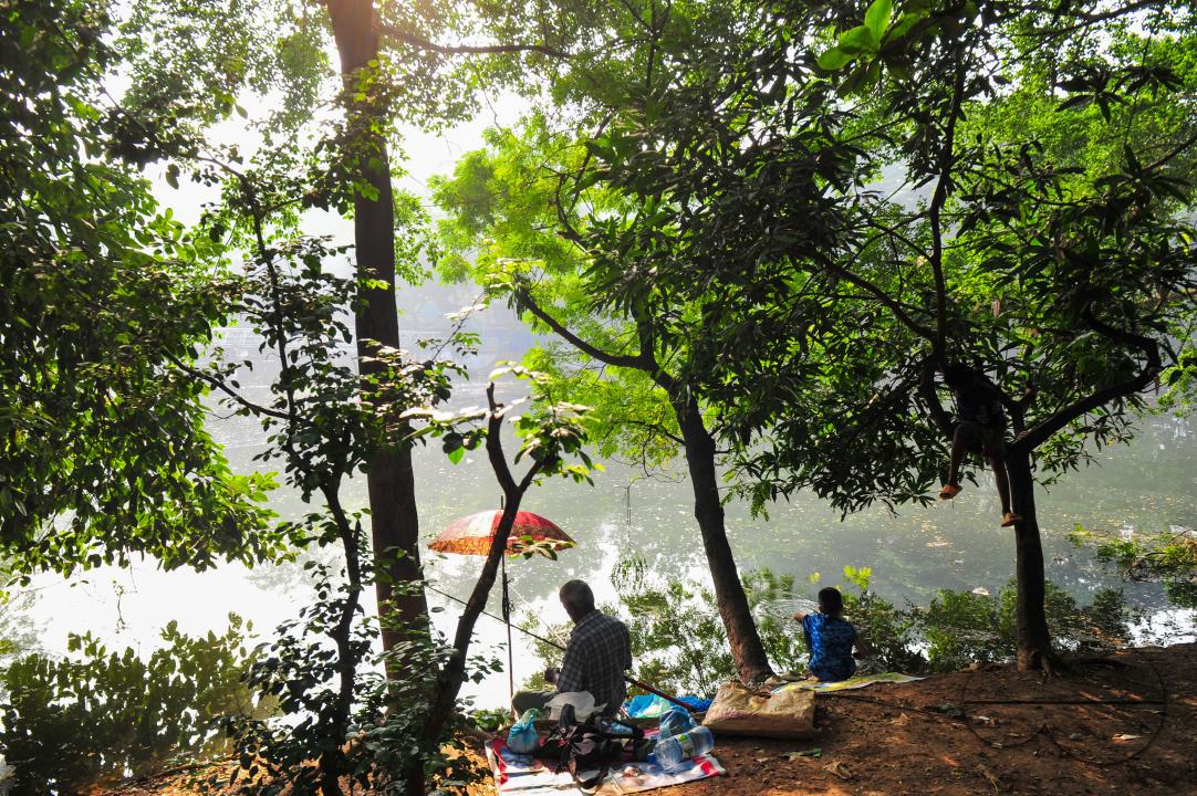 People playing volleyball in the Dhanmondi Lake