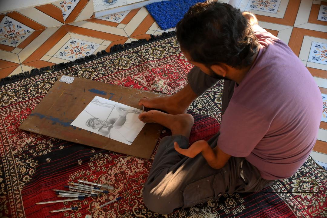 A 23-year-old differently abled artist Pralay Dey, is pursuing his bachelorâs degree in psychology from Tripura Central University