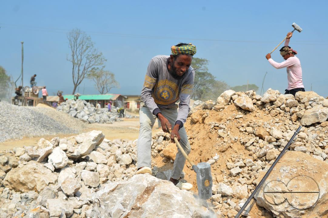 Male and female workers are breaking LC stones with a crusher machine in Bholaganj area, known as the 'Stone State' of Sylhet Companyganj Upazila
