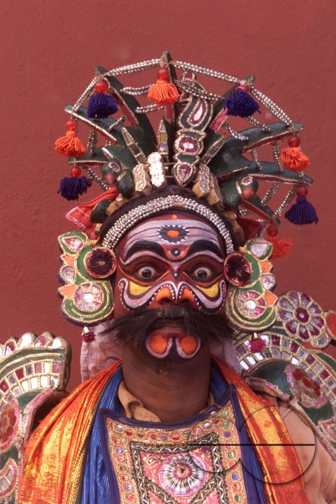 A South Indian dancer stands before a stage show at a dance festival in Kolkata