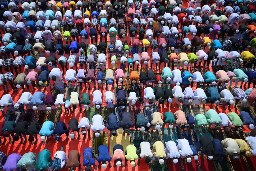 Devotees celebrate Eid-ul-Fitr with prayers ("Namaz") at a mosque in Agartala