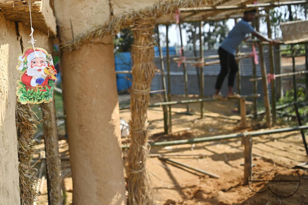 People decorate a church in preparation for Christmas Day at Mariam Church, Agartala
