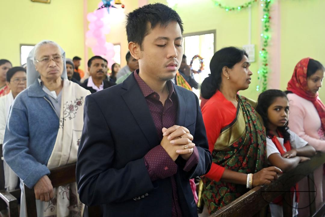 Christians attend a Christmas Mass in Mariam Nagar Church at Agartala