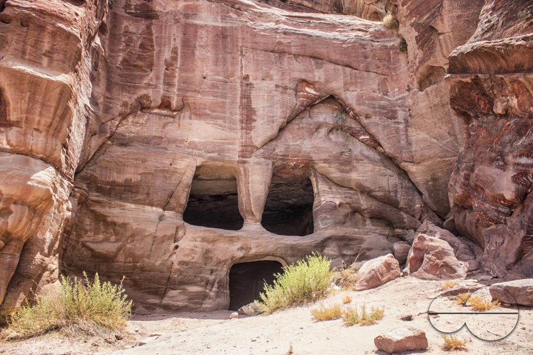 Front of a cave dwelling with carved door and windows in the UNESCO heritage site