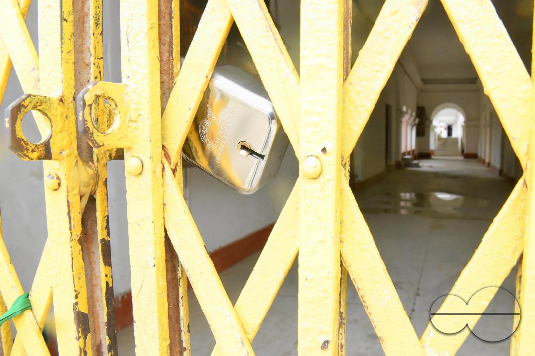 A locked gate of a government school during cyclone MidhiliÂ in Agartala