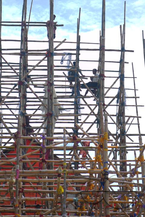 Workers are making a temporary bamboo structure, locally called "Pandal", for the upcoming Durga Puja in Agartala